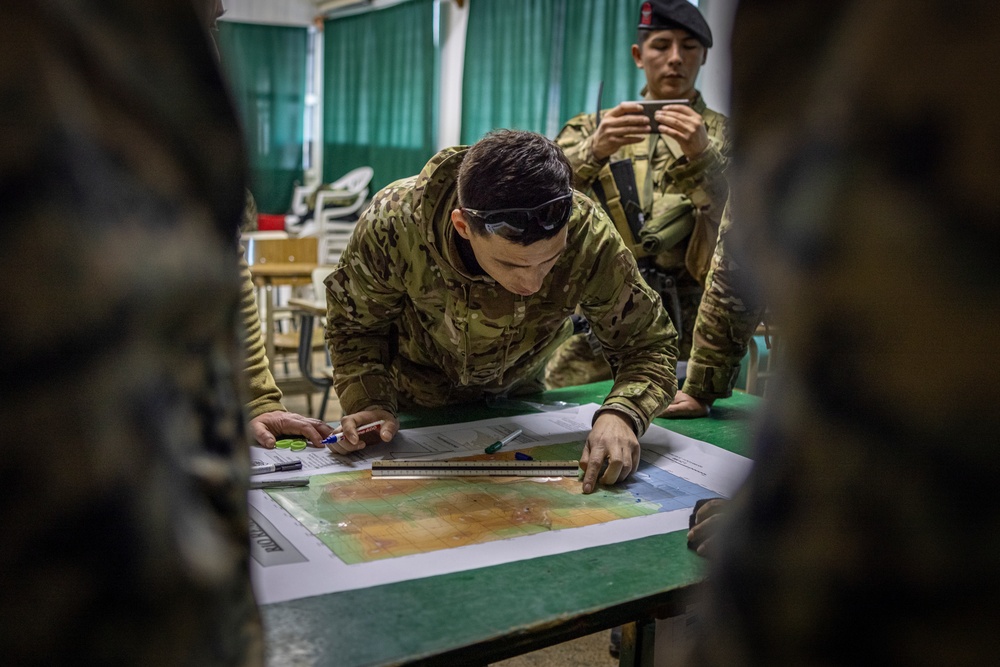 U.S. Marine Corps Mountain Warfare Instructors conduct long-range movement with Argentine marines