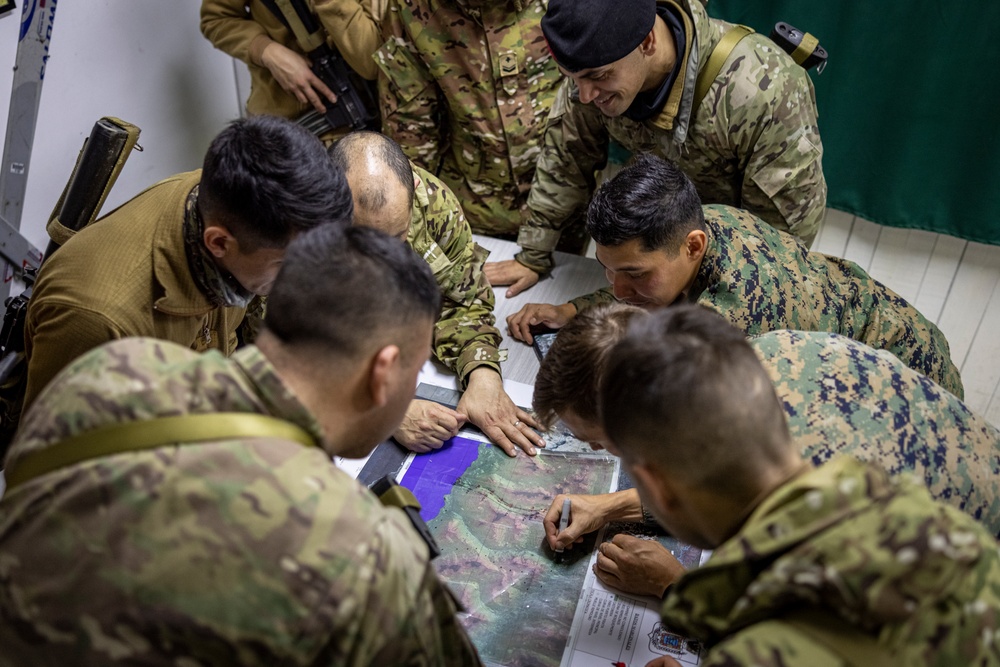 U.S. Marine Corps Mountain Warfare Instructors conduct long-range movement with Argentine marines