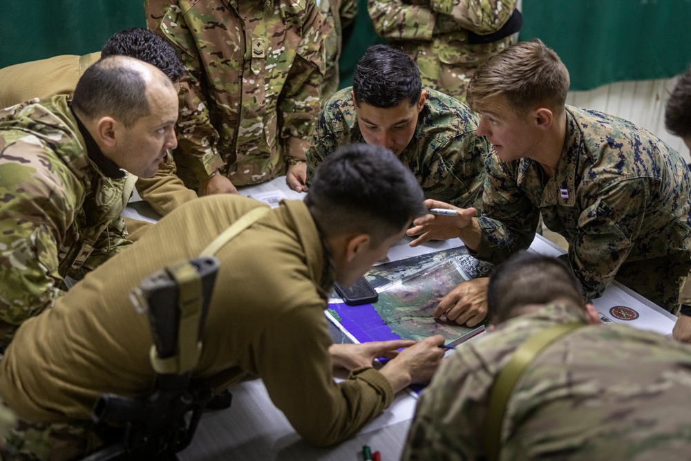 U.S. Marine Corps Mountain Warfare Instructors conduct long-range movement with Argentine marines