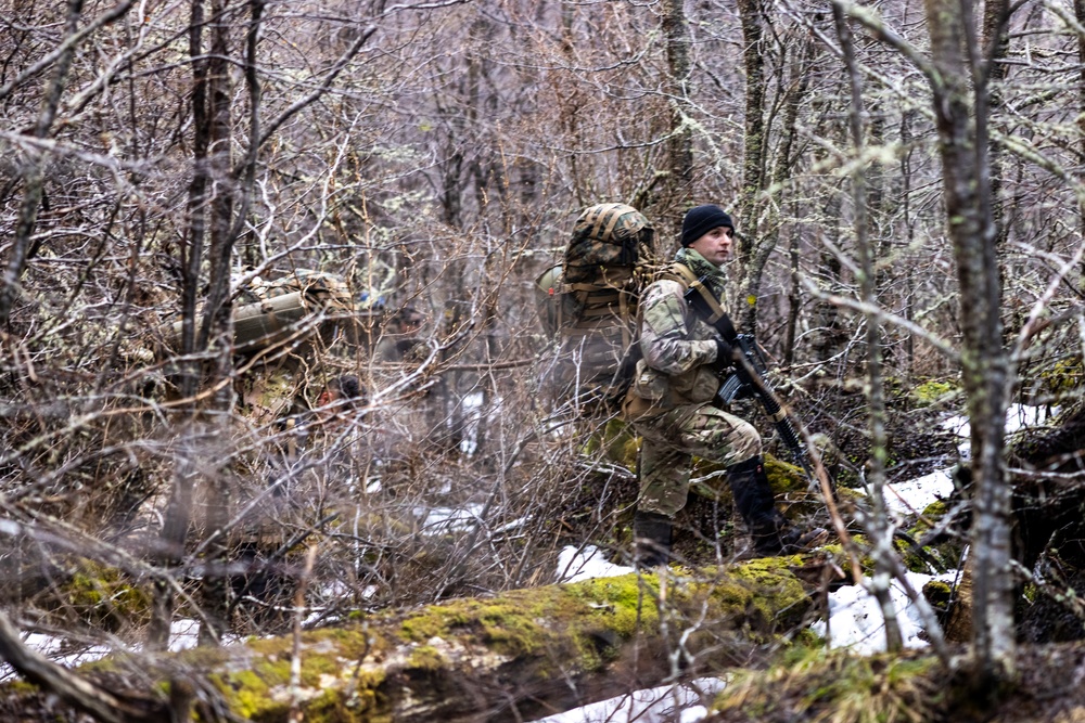 U.S. Marine Corps Mountain Warfare Instructors conduct long-range movement with Argentine marines