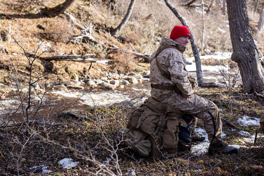 U.S. Marine Corps Mountain Warfare Instructors conduct long-range movement with Argentine marines