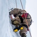 U.S. Marine Corps Mountain Warfare Instructors climb an ice wall with Argentine marines