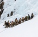 U.S. Marine Corps Mountain Warfare Instructors climb an ice wall with Argentine marines
