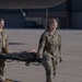 Members from the 21st Medical Group and the 21st Security Forces Squadron recently partnered with the 302nd Aeromedical Evacuation Squadron to conduct Medic-X training, where they practiced patient on-loading and off-loading from aircraft.