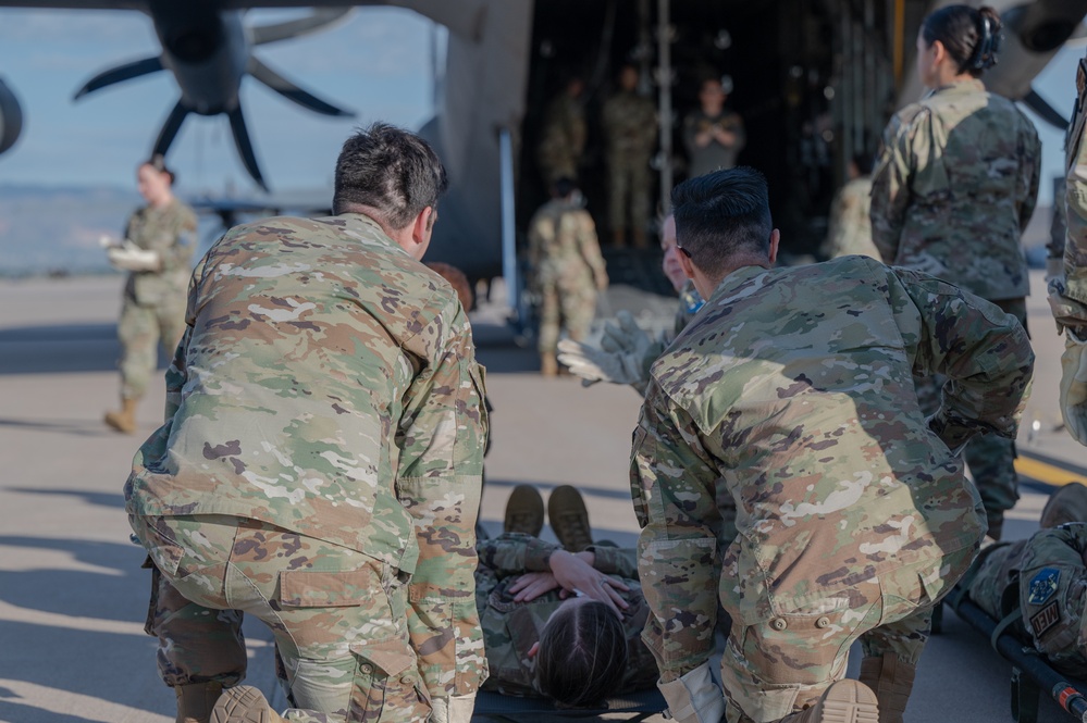 Members from the 21st Medical Group and the 21st Security Forces Squadron recently partnered with the 302nd Aeromedical Evacuation Squadron to conduct Medic-X training, where they practiced patient on-loading and off-loading from aircraft.