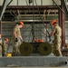 Two airmen prepare to load BLU-109, 2000lb ordnance onto the Munitions Assembly Conveyor during the 7th annual AMMO Rodeo bomb building competition at Volk Field, WI.