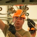 Staff Sgt. Matthew Garcia, assigned to the 5th Bomb Wing at Minot Air Force Base, N.D., attaches slings to a 2,000-lb, Mark-84 general purpose heavy unguided bomb body during the 2024 Ammo Rodeo at Volk Field, Wis.