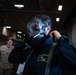 A Nimitz Sailor Dons an M50 Mask During a General Quarters Drill