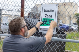 Evacuation Signage and Black Flags Help Protect Norfolk Naval Shipyard Workforce