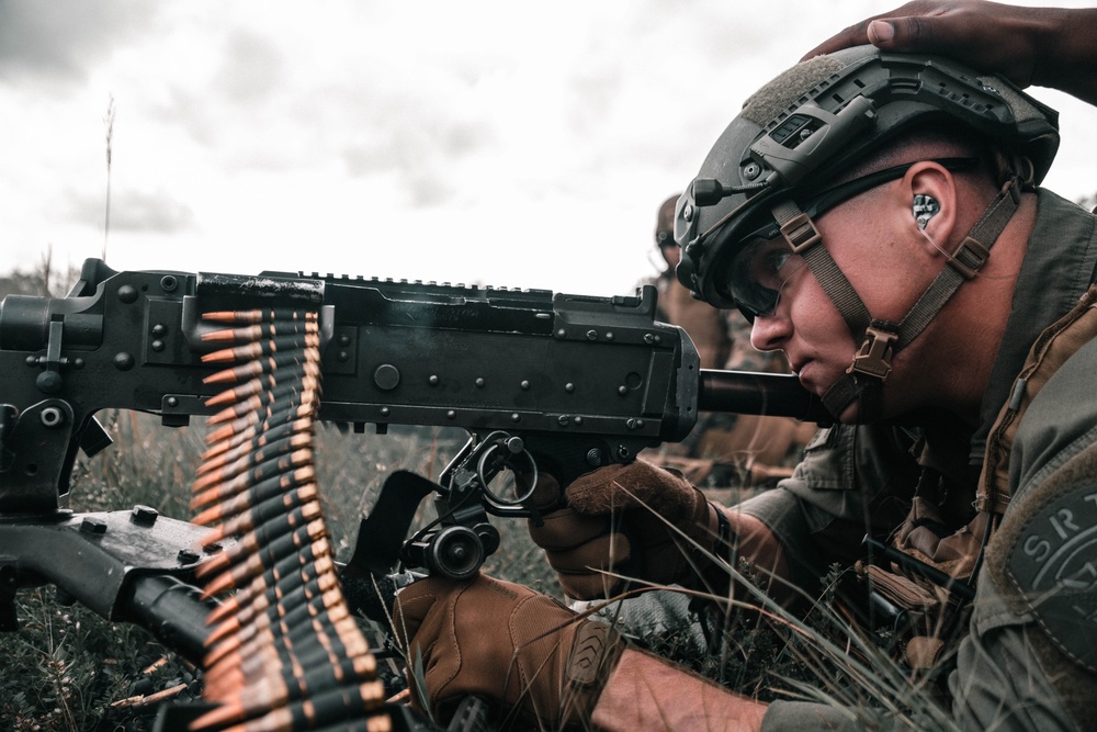 U.S. Marines with Security Battalion, Marine Corps Base Quantico, participate in a machine gun range