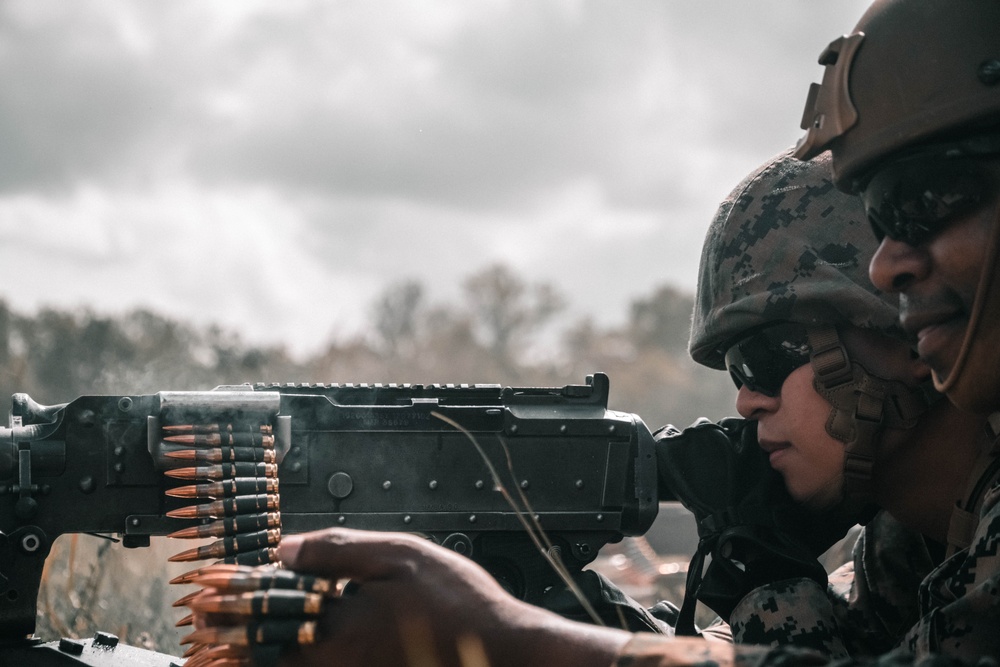 U.S. Marines with Security Battalion, Marine Corps Base Quantico, participate in a machine gun range