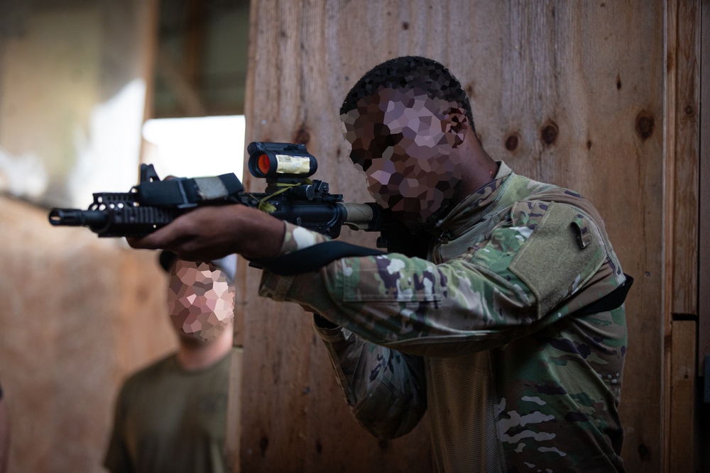 Alabama National Guard Special Forces Soldiers conduct barrier and shoot house training