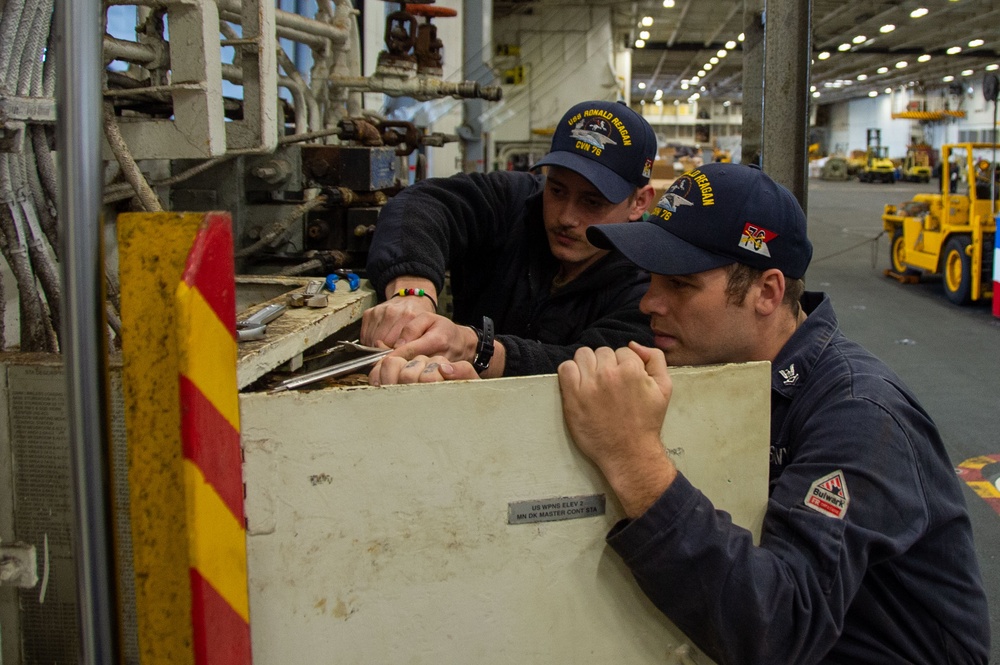 USS Ronald Reagan (CVN 76) Sailors conduct maintenance