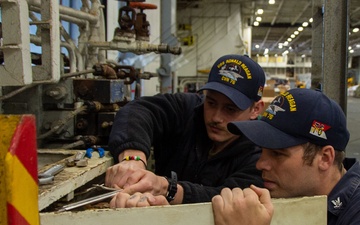 USS Ronald Reagan (CVN 76) Sailors conduct maintenance