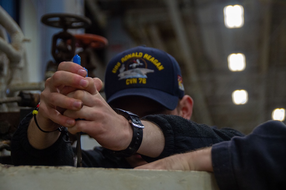 USS Ronald Reagan (CVN 76) Sailors conduct maintenance