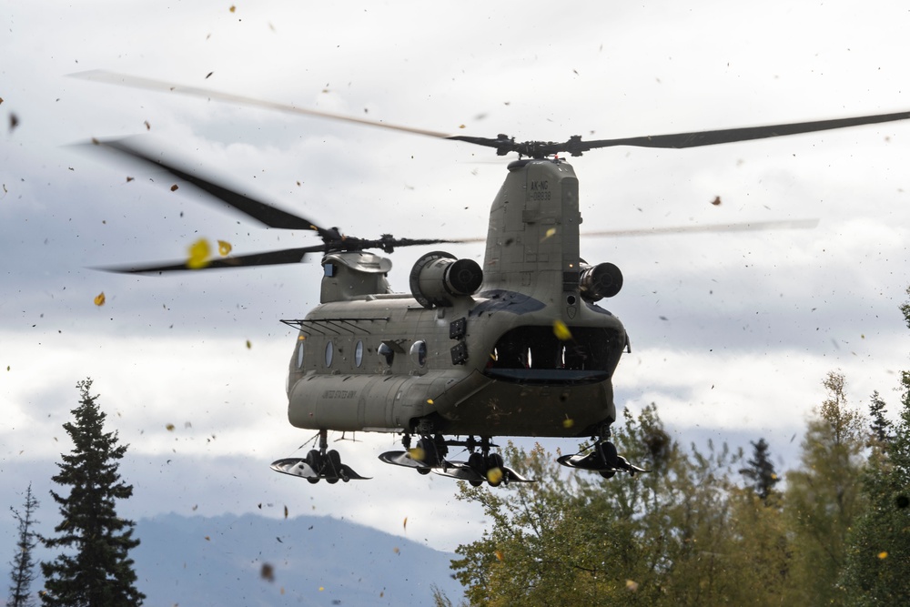 U.S. Air Force and Alaska Army National Guard conduct joint munitions sling load operations