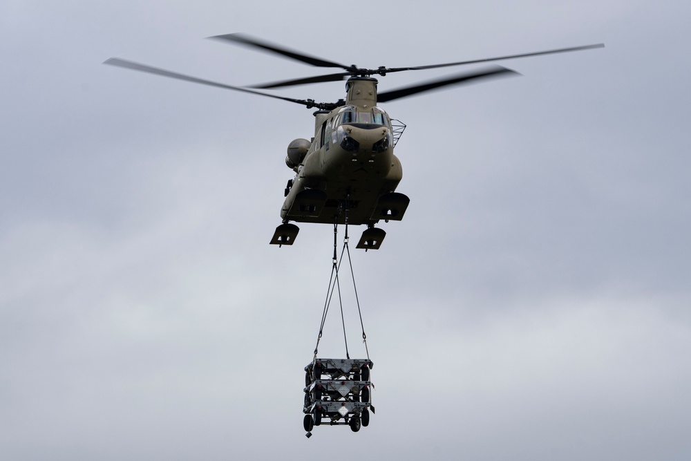 U.S. Air Force and Alaska Army National Guard conduct joint munitions sling load operations