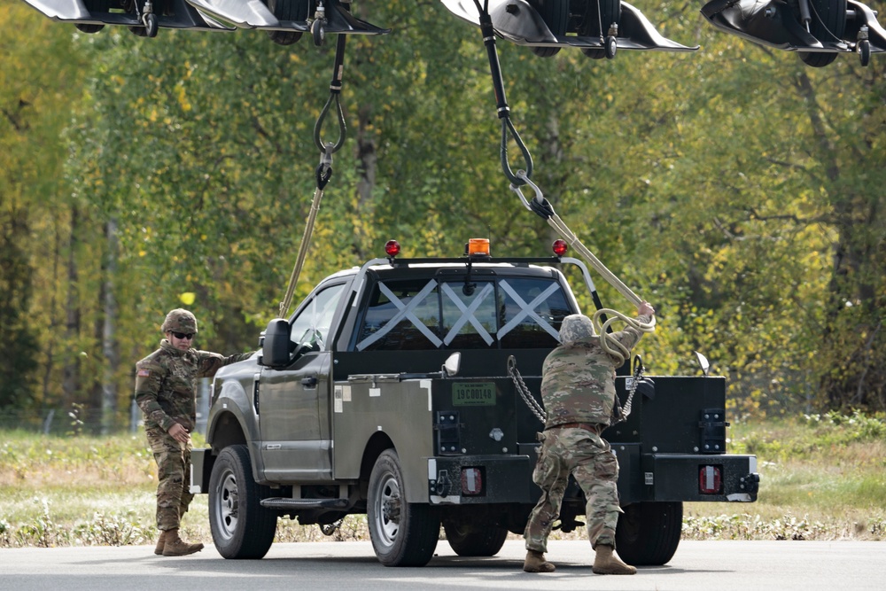 U.S. Air Force and Alaska Army National Guard conduct joint munitions sling load operations