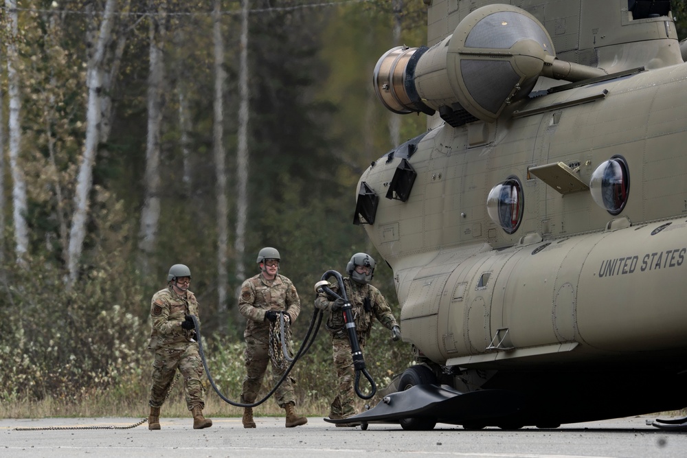 U.S. Air Force and Alaska Army National Guard conduct joint munitions sling load operations