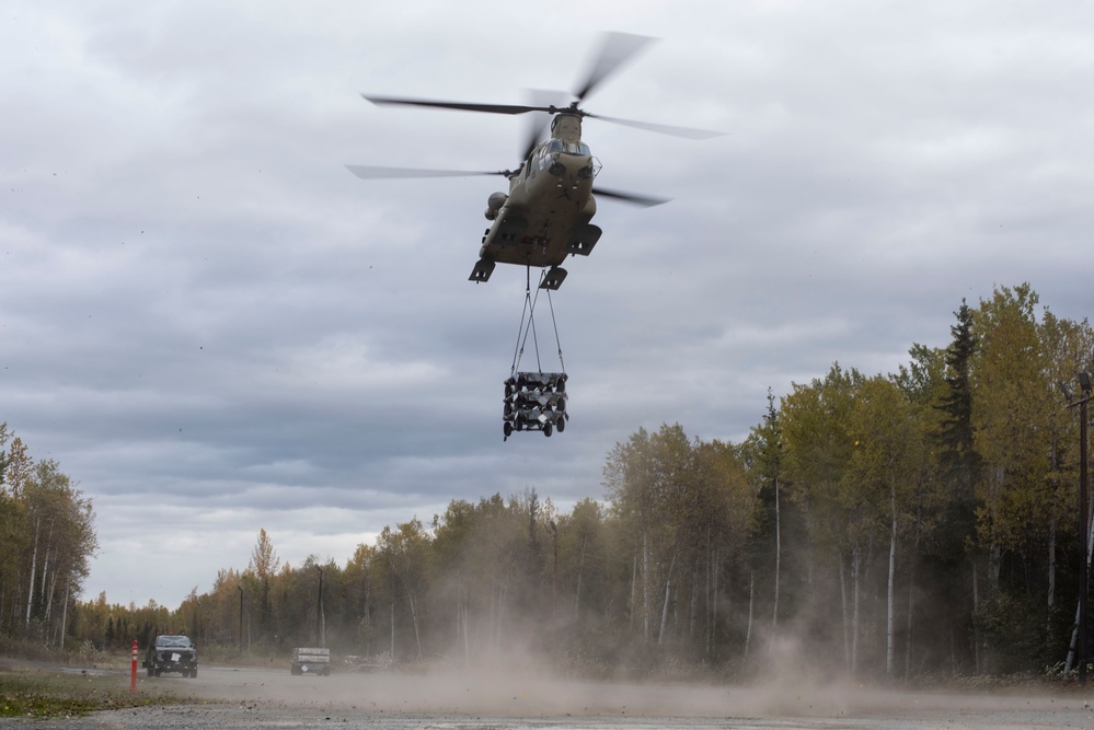 U.S. Air Force and Alaska Army National Guard conduct joint munitions sling load operations