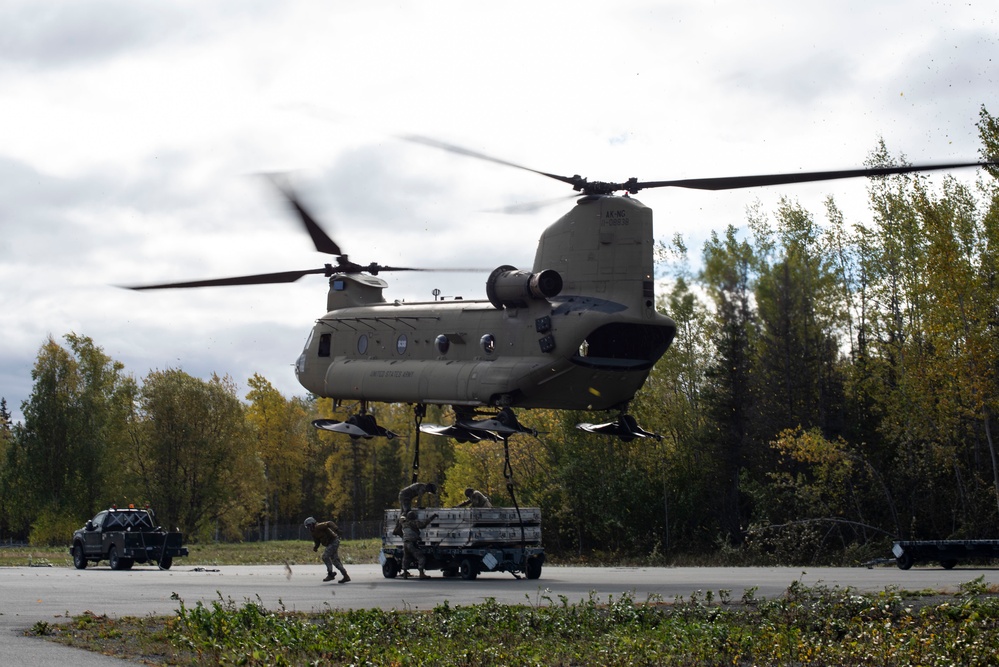 U.S. Air Force and Alaska Army National Guard conduct joint munitions sling load operations