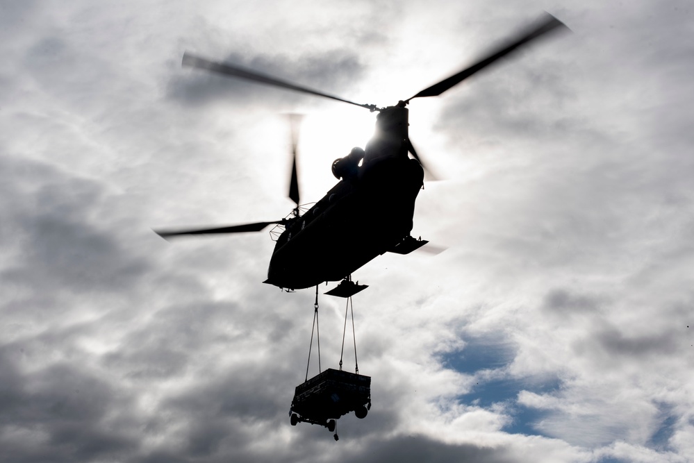 U.S. Air Force and Alaska Army National Guard conduct joint munitions sling load operations