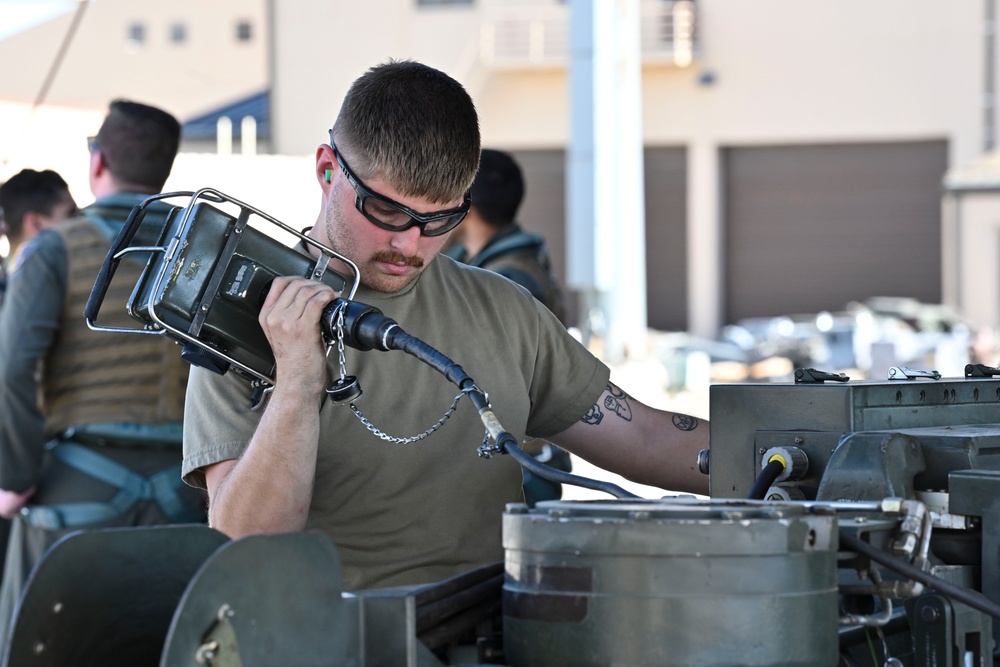 Ellsworth weapons load teams prepare B-1B Lancer during Raider Reach exercise