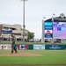 19 AW commander throws first pitch, engages with community