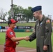 19 AW commander throws first pitch, engages with community