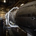 Nimitz Sailor Conducts Maintenance on a Jet Engine