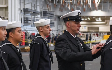 USS Ronald Reagan (CVN 76) Sailors conduct uniform inspections