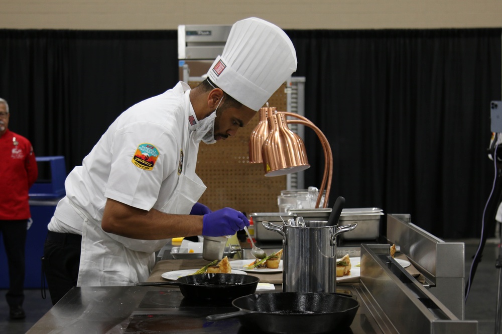 Culinary Specialist 2nd Class Larry Burns competes at the American Culinary Federation (ACF) National Convention in Phoenix, Ariz. on July 16, 2024.