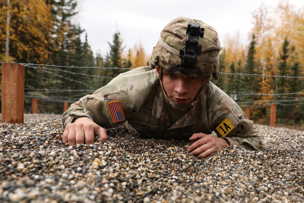 U.S. Soldier Crawls Under Barbed Wire in Best Medic Competition