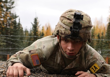 U.S. Soldier Crawls Under Barbed Wire in Best Medic Competition