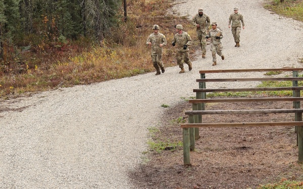 U.S. Soldiers Running Trail in Best Medic Competition