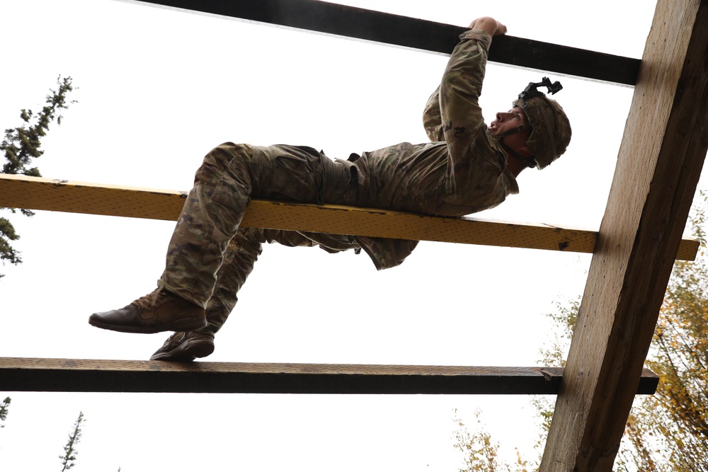 U.S. Soldier Climbs Horizontal Beams in Best Medic Competition