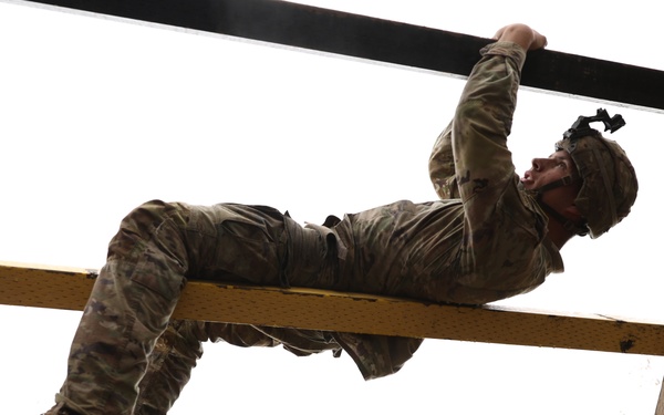 U.S. Soldier Climbs Horizontal Beams in Best Medic Competition