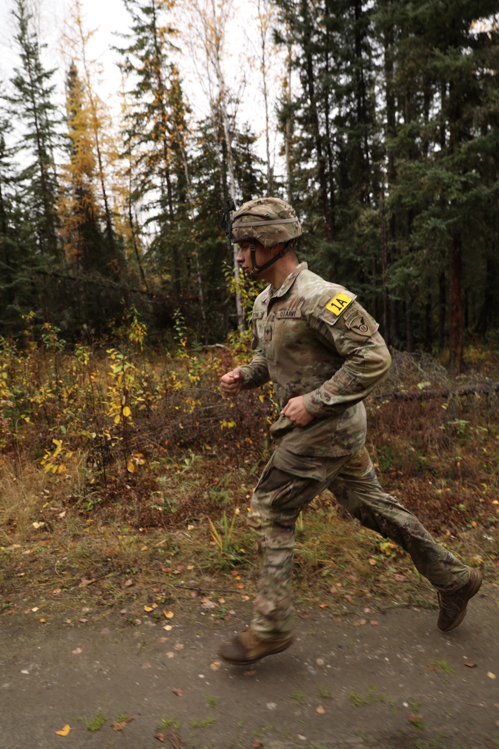 U.S. Soldier Running Through Forest in Best Medic Competition