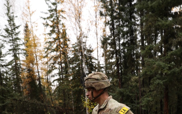 U.S. Soldier Running Through Forest in Best Medic Competition