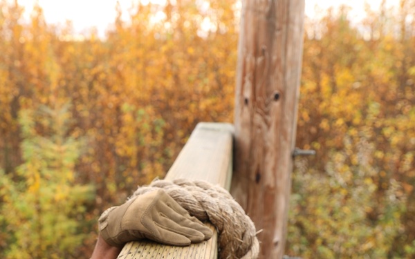 U.S. Soldier Grips Obstacle in Best Medic Competition