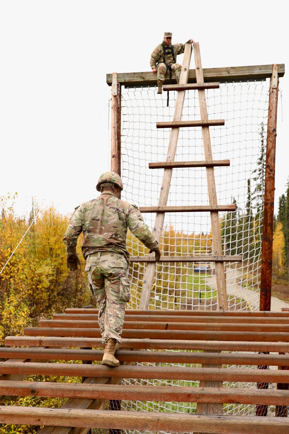 U.S. Soldier Approaches Ladder Obstacle in Best Medic Competition