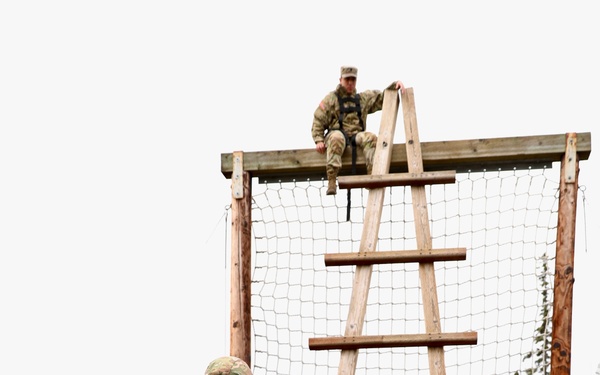 U.S. Soldier Approaches Ladder Obstacle in Best Medic Competition