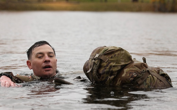U.S. Soldier Pulls Gear in Combat Water Survival Event