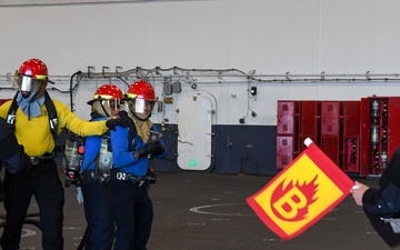 USS Ronald Reagan (CVN 76) Sailors conduct training during a general quarters drill