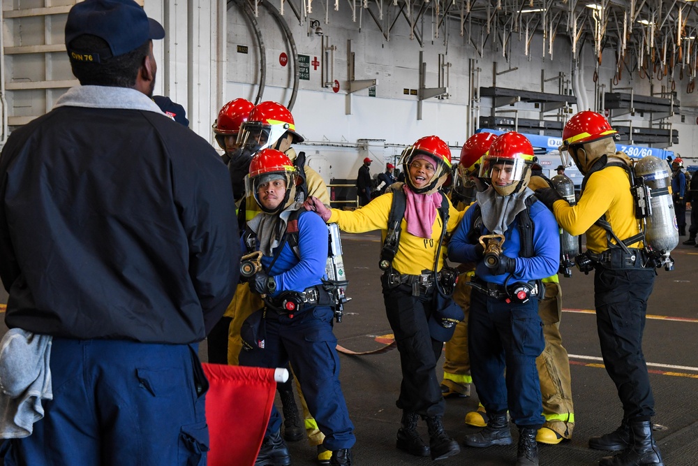 USS Ronald Reagan (CVN 76) Sailors conduct training during a general quarters drill