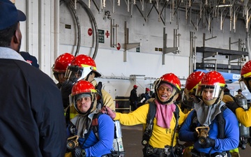 USS Ronald Reagan (CVN 76) Sailors conduct training during a general quarters drill