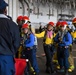 USS Ronald Reagan (CVN 76) Sailors conduct training during a general quarters drill