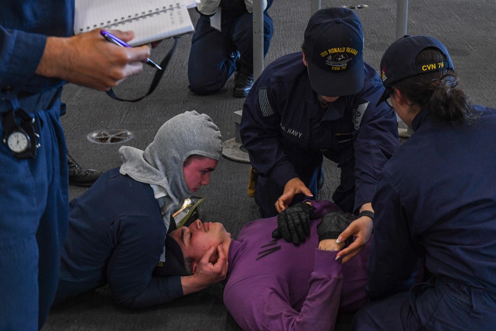 USS Ronald Reagan (CVN 76) Sailors conduct training during a general quarters drill