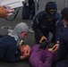 USS Ronald Reagan (CVN 76) Sailors conduct training during a general quarters drill