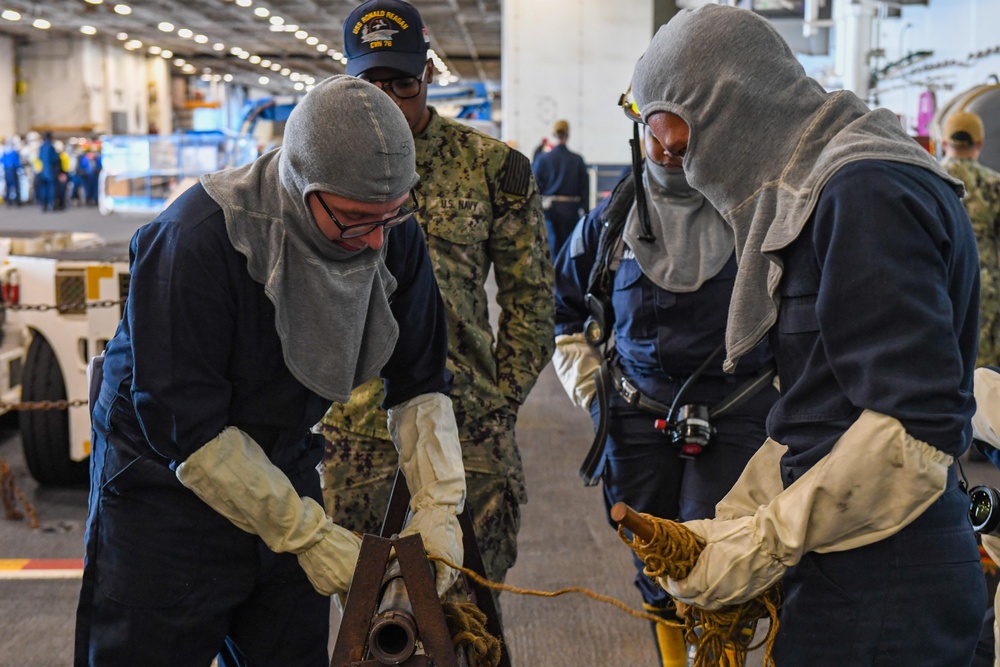 USS Ronald Reagan (CVN 76) Sailors conduct training during a general quarters drill